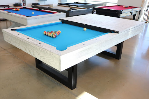 Custom pool table with blue felt and white wood frame – perfect for a game room.