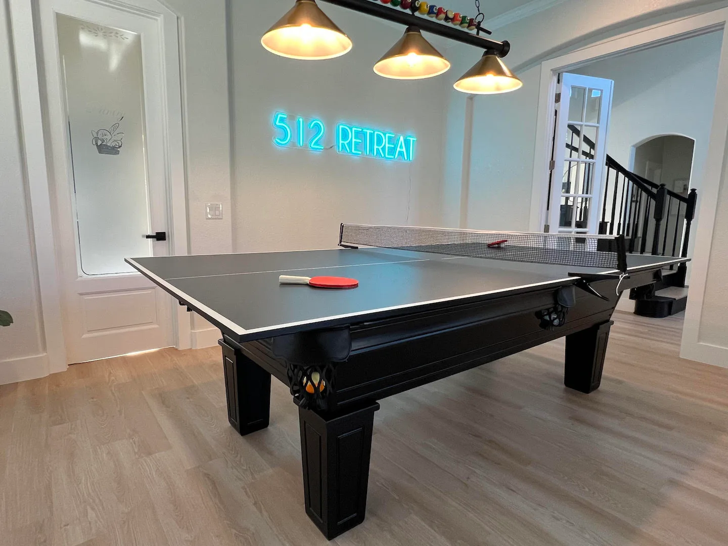 Custom pool table with a table tennis topper.
