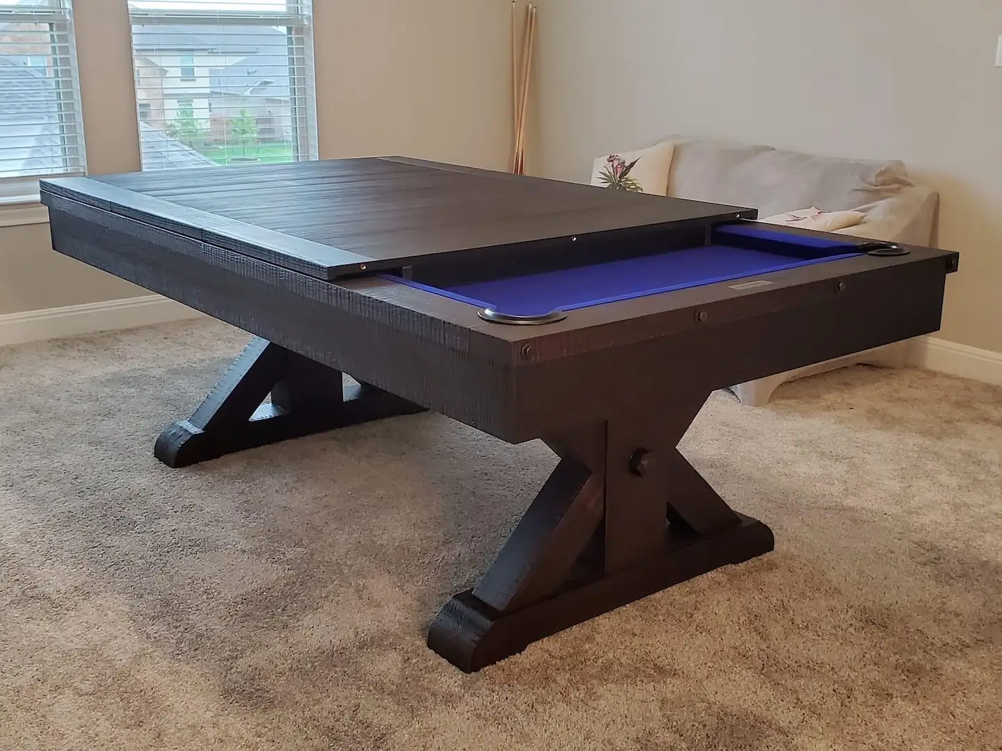 Custom pool table with purple felt and a table topper.