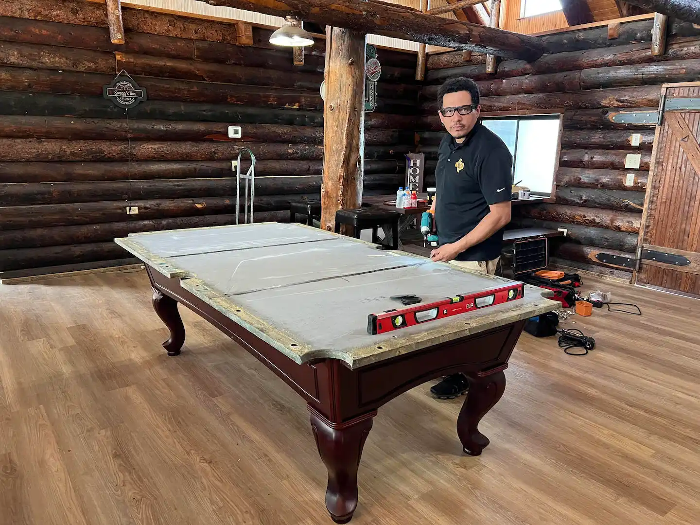 Trooper Billiards team working on a custom pool table installation.