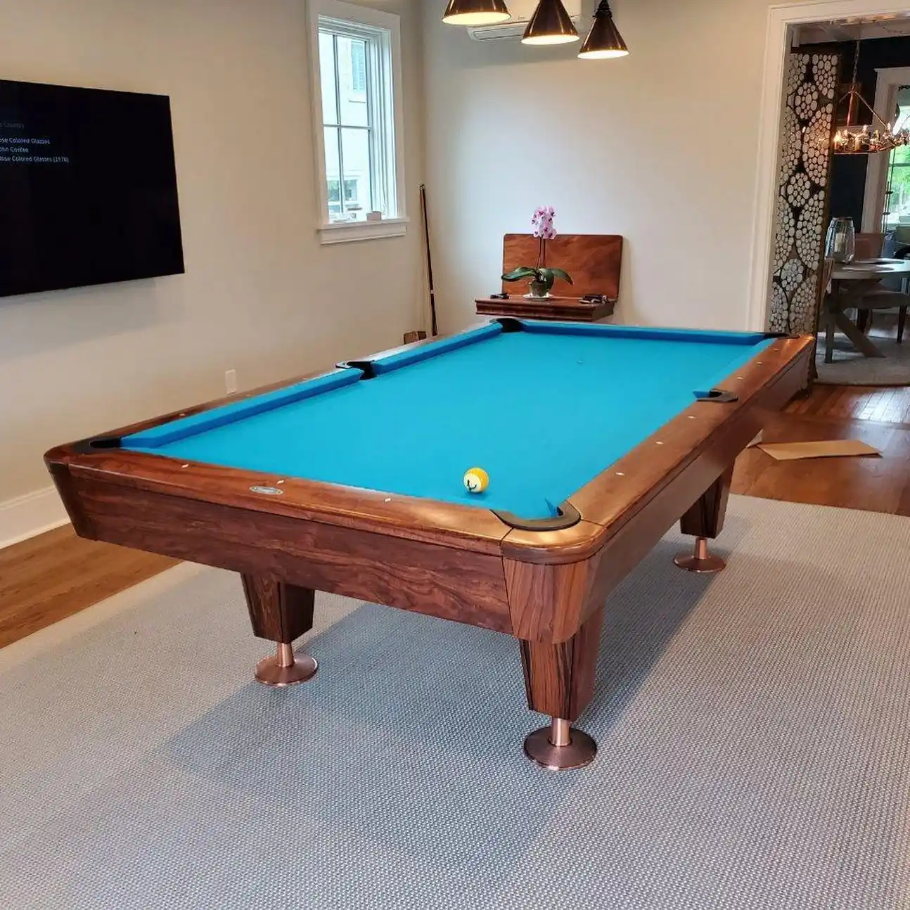 Diamond Pool Table with blue felt in a living room after being moved by Trooper Billiards.