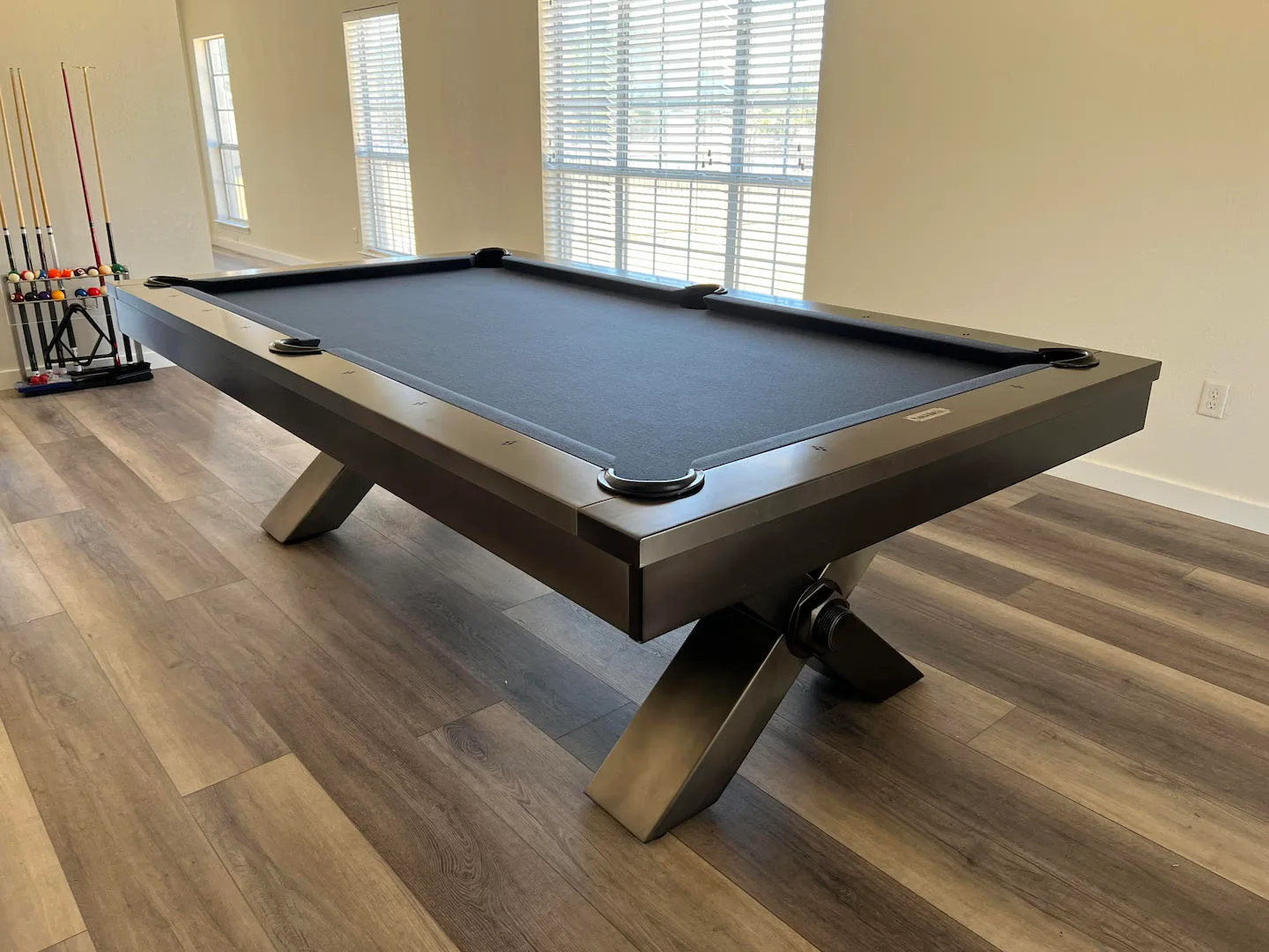 The Vox pool table with a metal frame and titanium Championship felt installed in a home by Trooper Billiards.